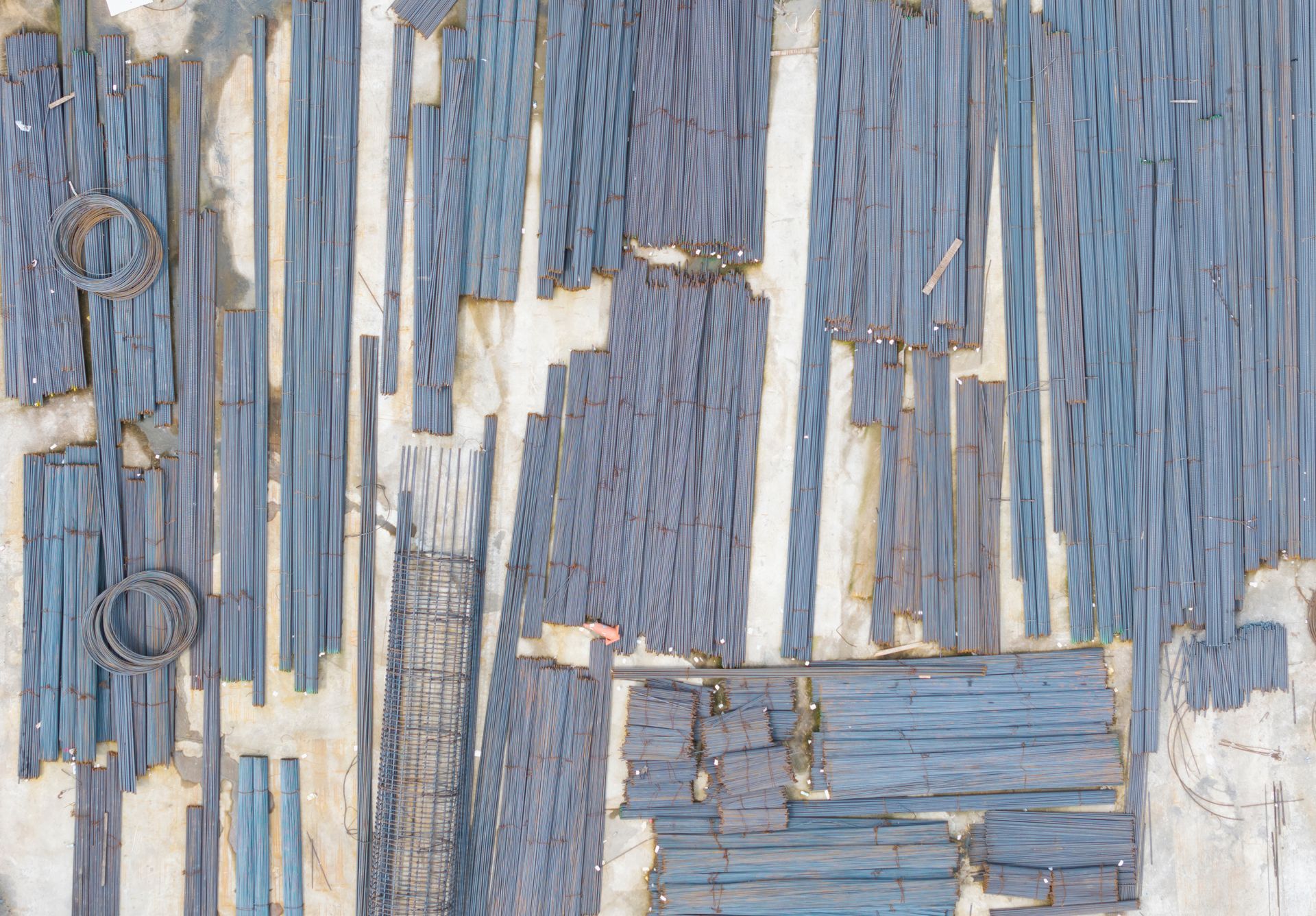 Aerial steel rebar construction site material storage.