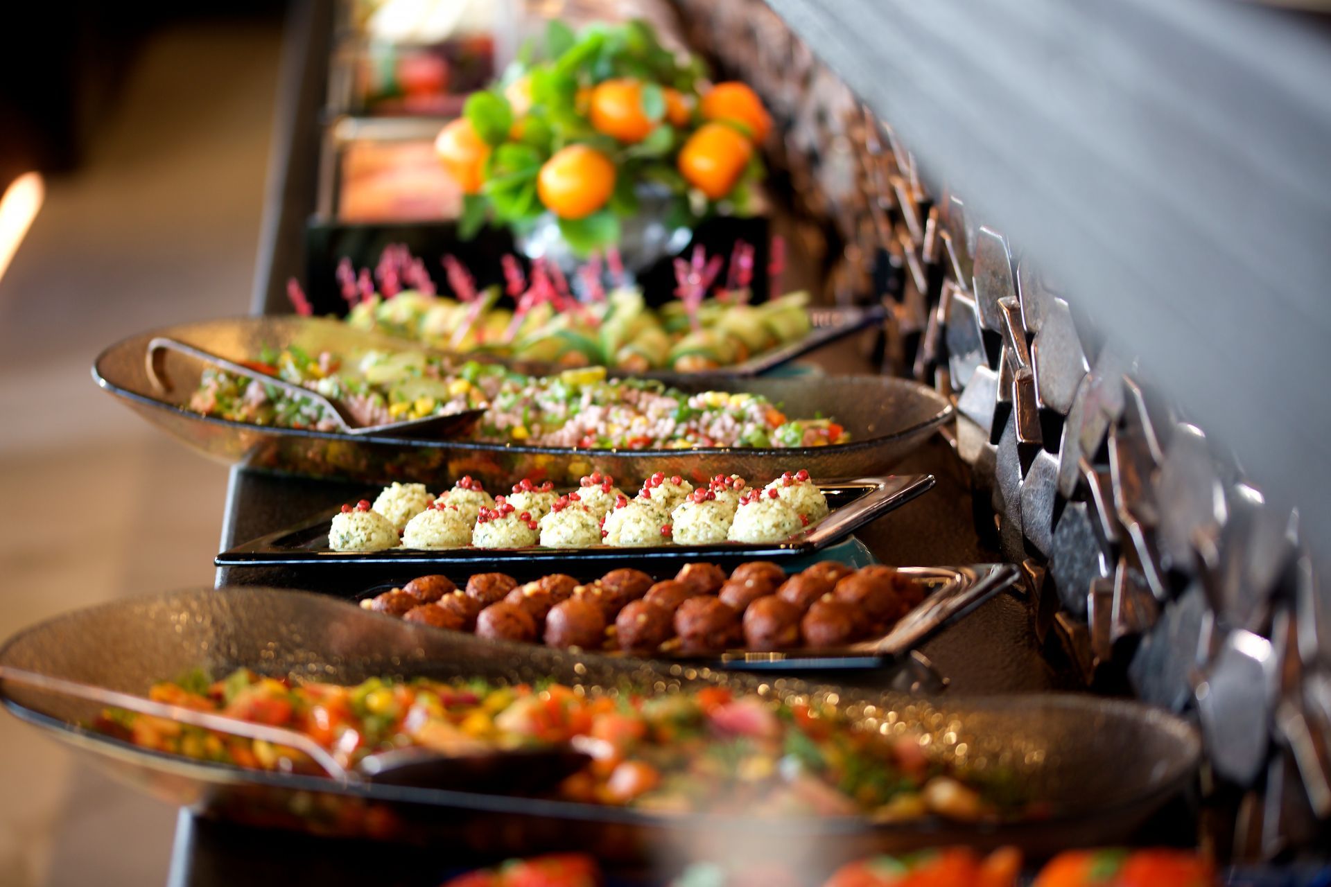 A buffet line filled with lots of different types of food.