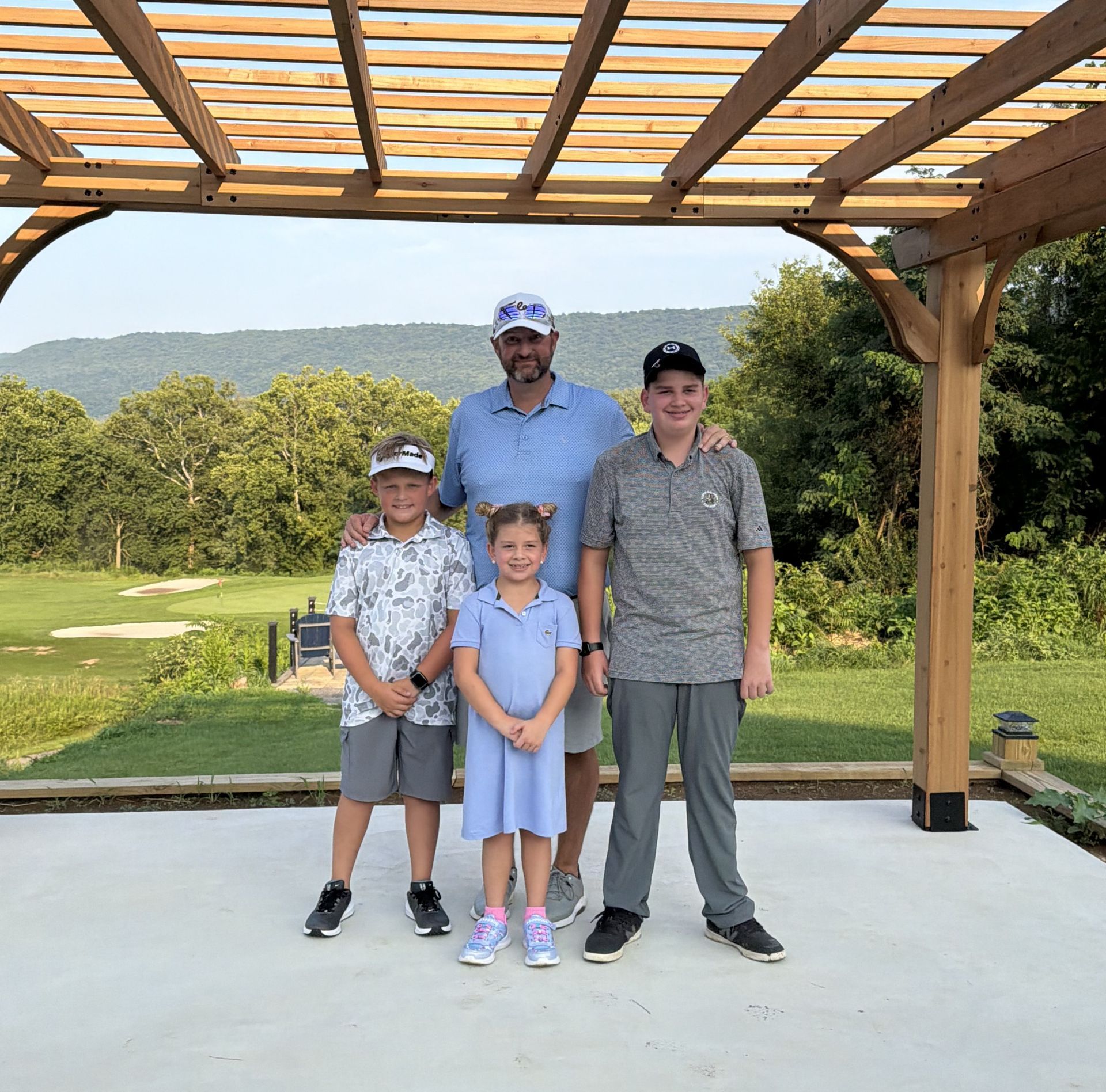 A group of people are playing golf on a golf course.