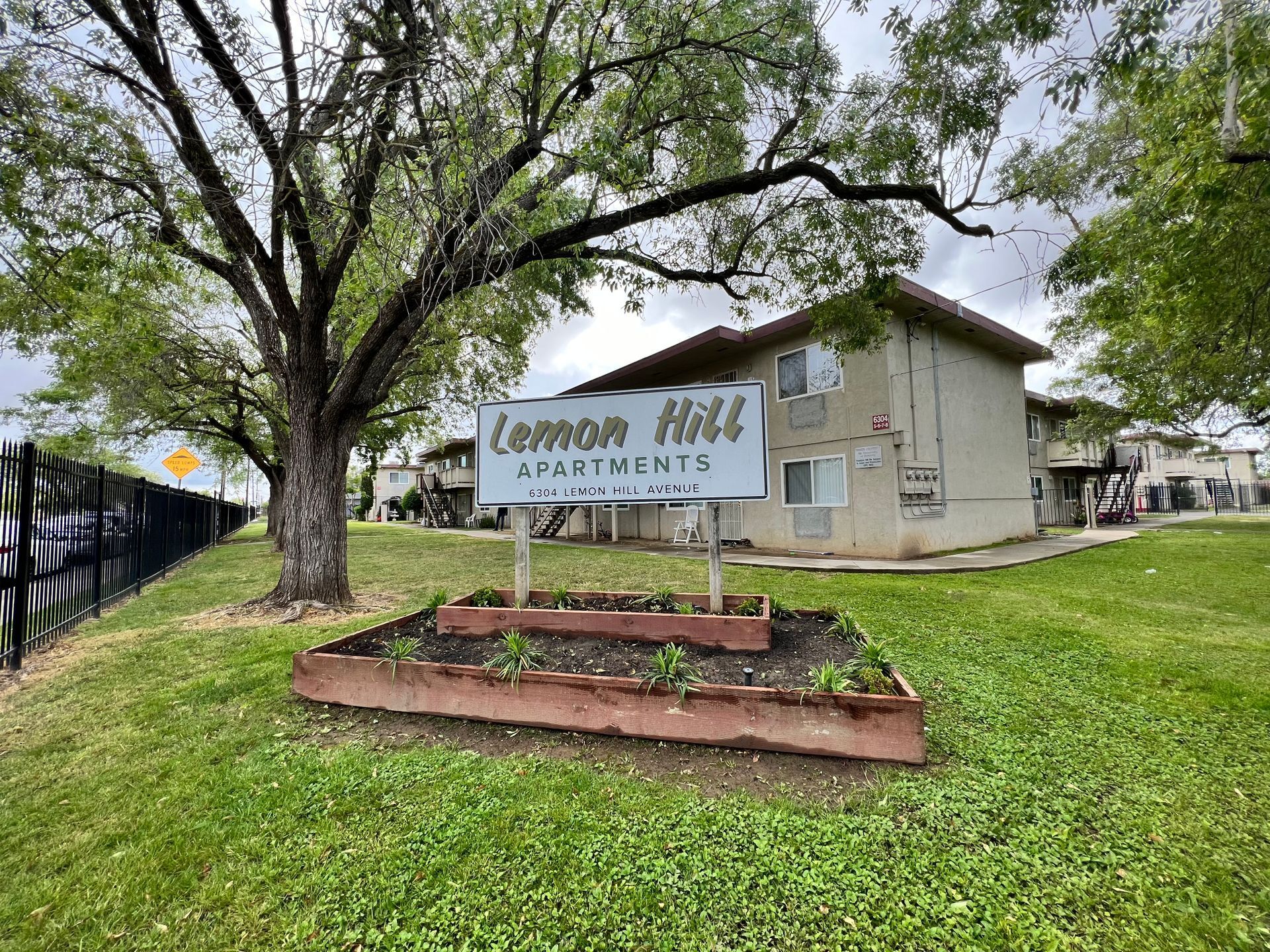 Photo of Lemon Hill Apartments with Sign and Tree