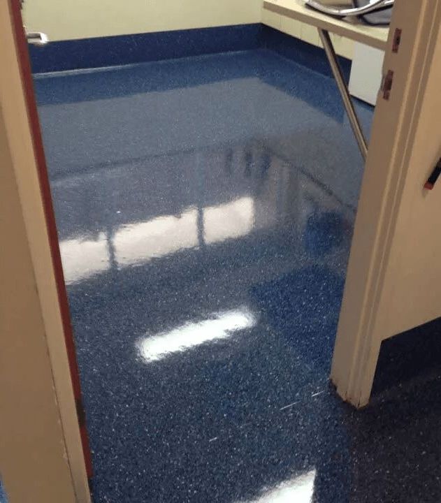A Room With a Blue Floor and a White Door — The Tile & Stone Specialists in Maroochydore, QLD