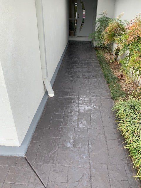 A Walkway Leading to a Doorway in a House — The Tile & Stone Specialists in Peregian Beach, QLD