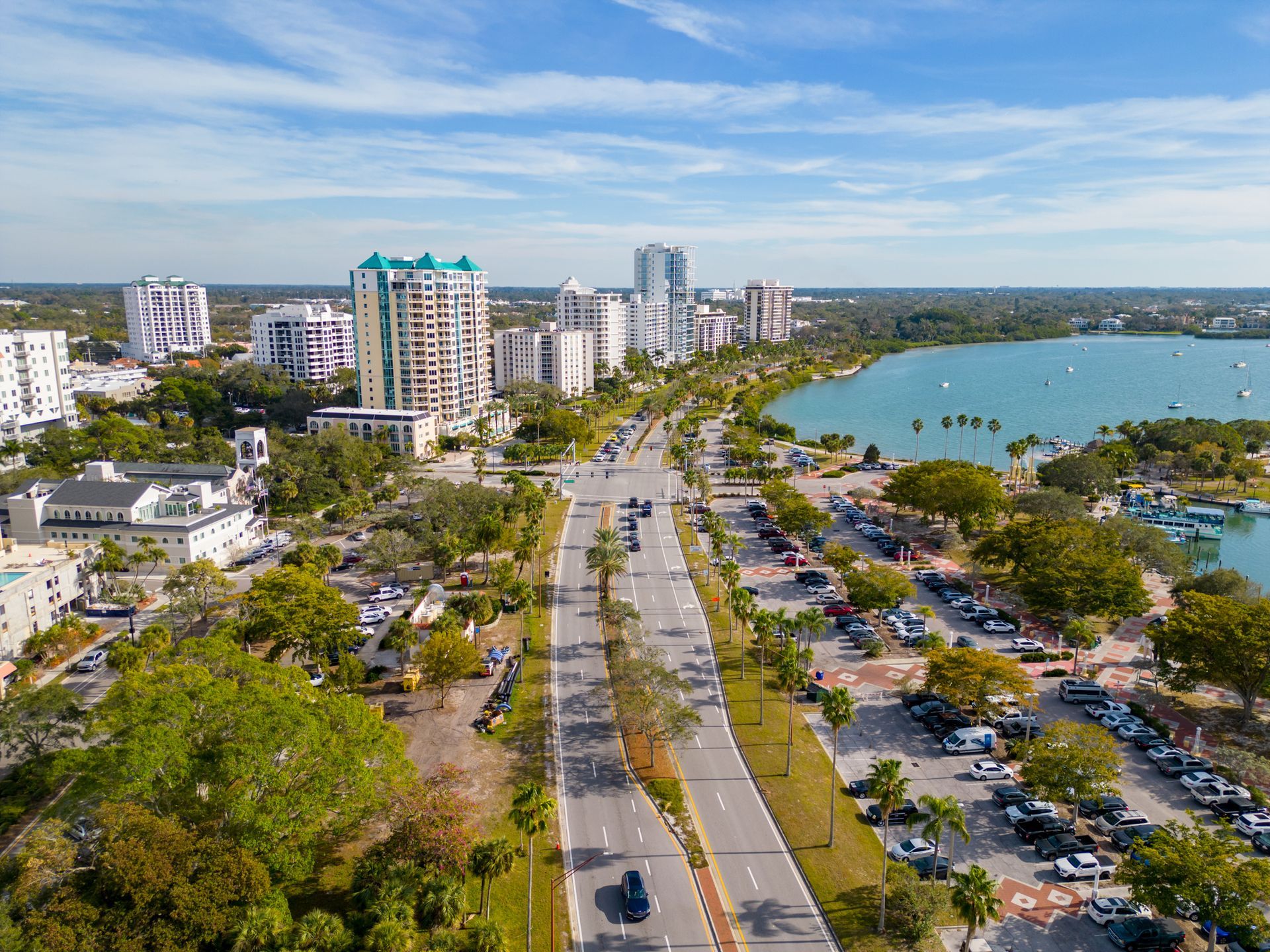 An aerial view of a city with a lake in the background.
