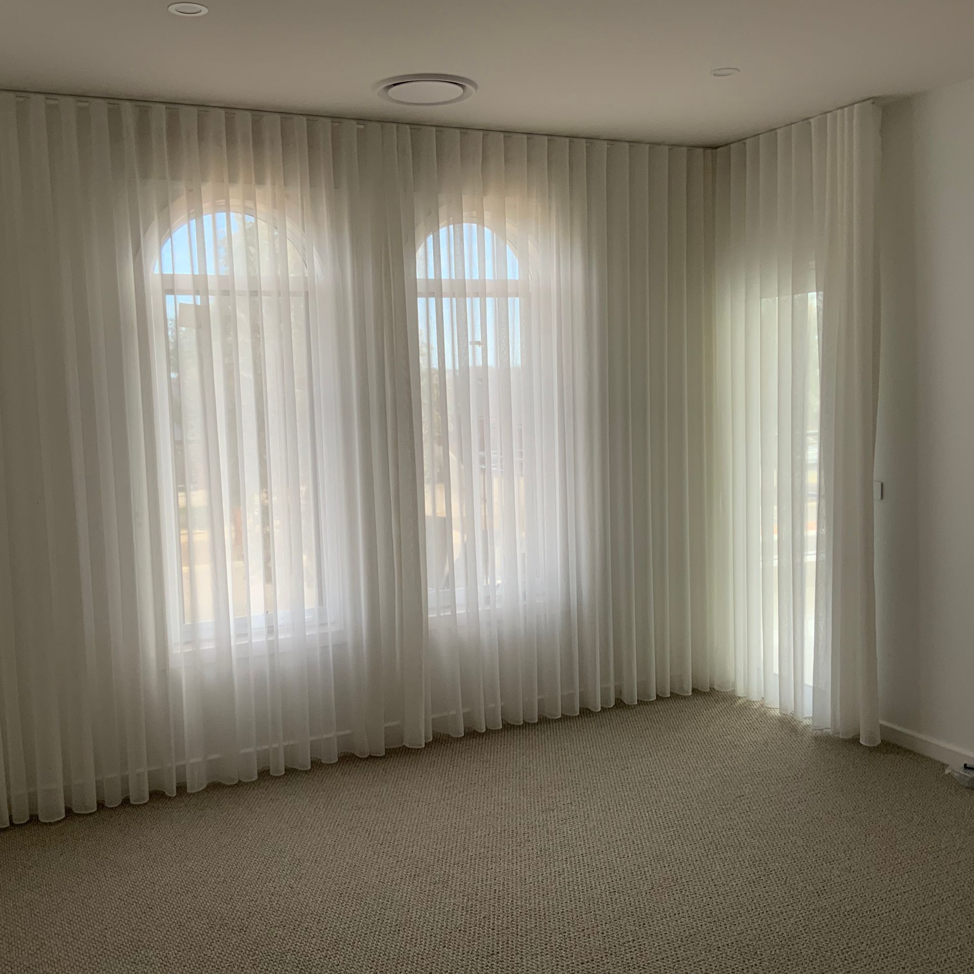 Elegant Living Room With Grey Sofa, Curtains, Glass Table — GV Blinds in Shepparton, VIC