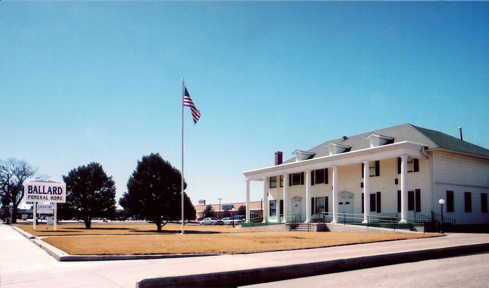 Ballard Funeral Home & Crematory - Outside View of Building with Flag