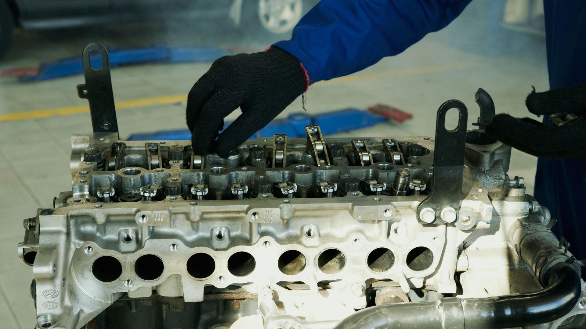 Mechanic Assembling Engine Cylinder Head Components | Brady’s Auto Repair
