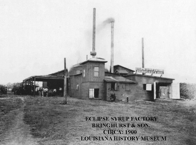A black and white photo of the eclipse syrup factory