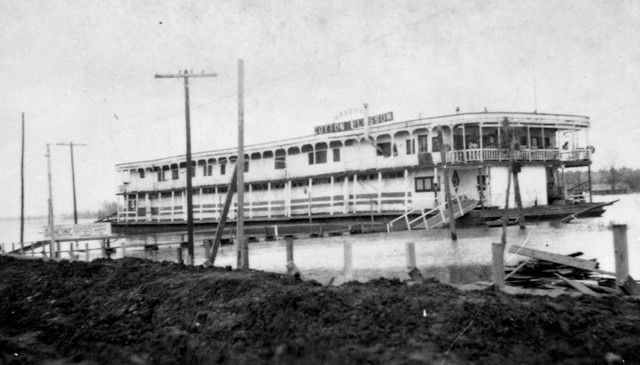 A black and white photo of a boat in the water