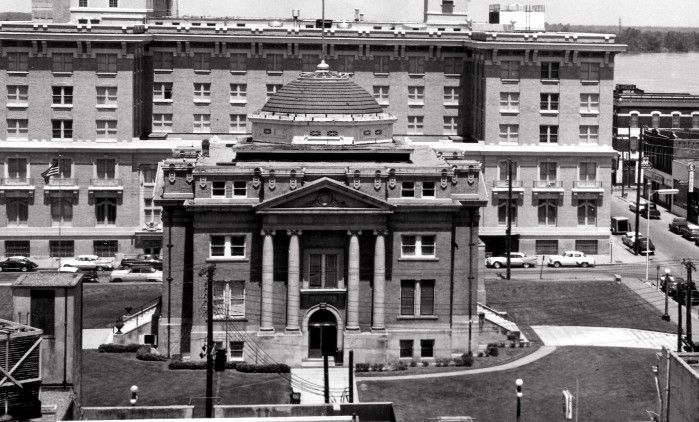 A black and white photo of a large building