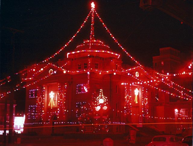 A building with red lights on it at night