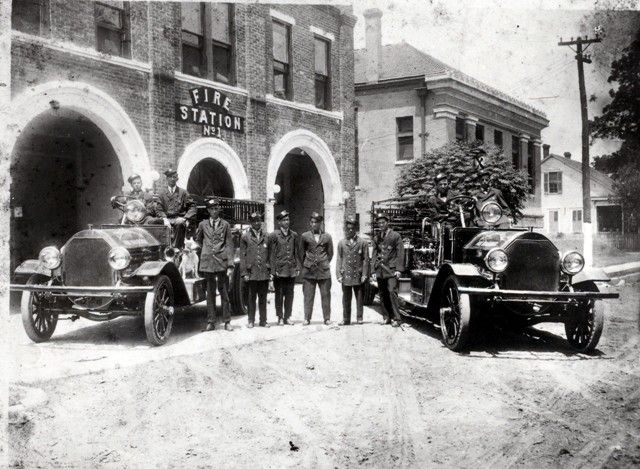 A black and white photo of a fire station