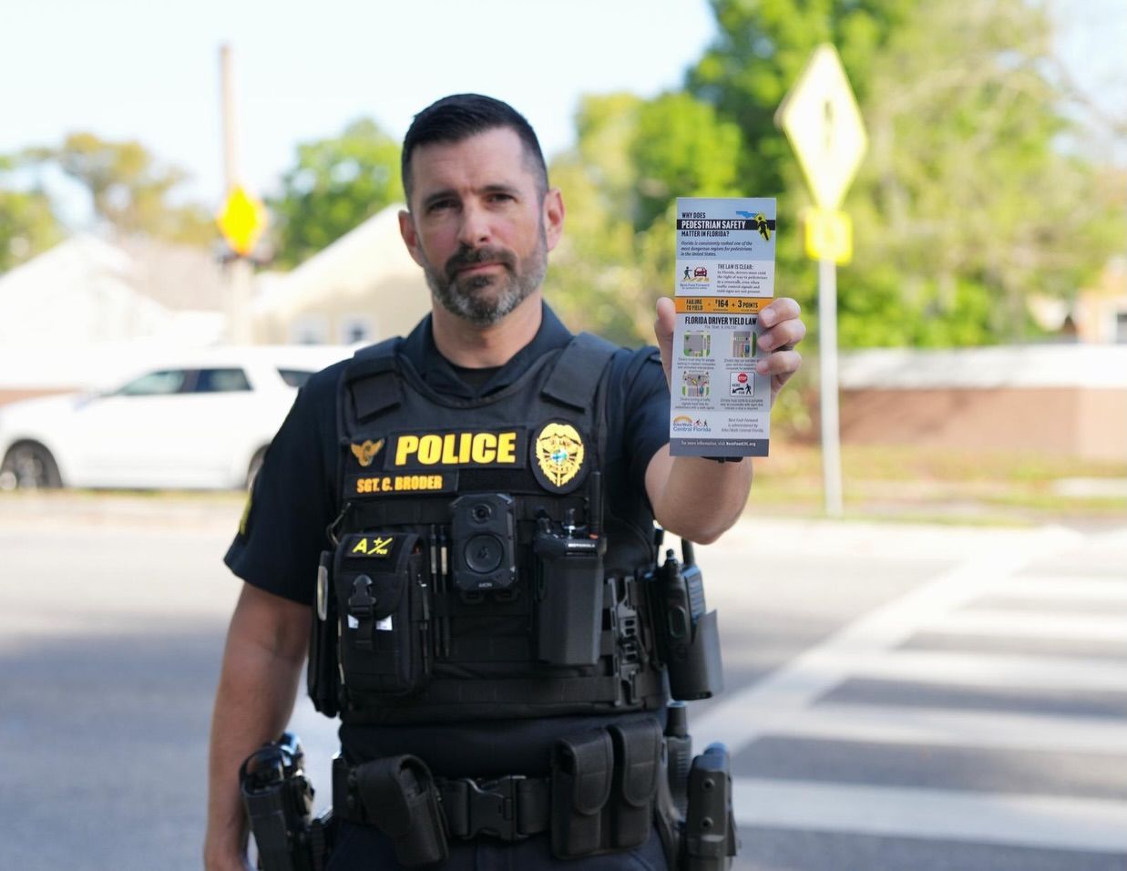 (Law enforcement with BFF program sheets that are handed out during crosswalk enforcement campaigns) 