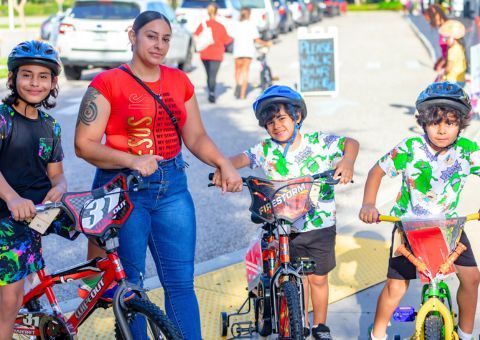 family with children on bikes