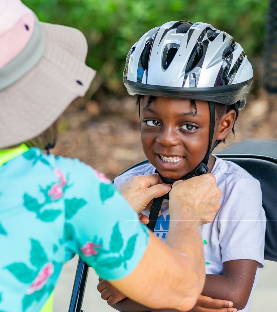 Child being fitted for helmet