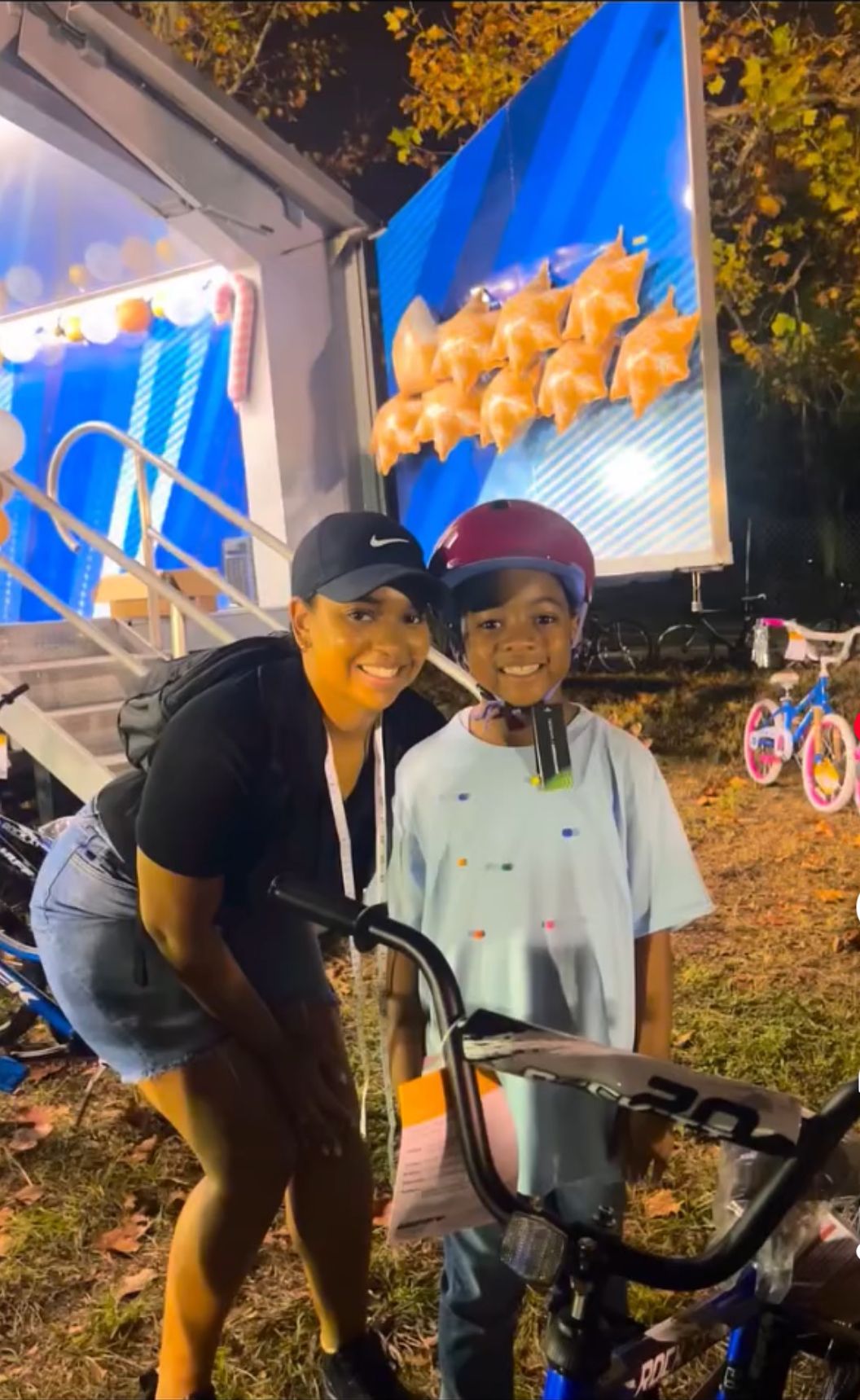 Patra Stanley with child wearing helmet