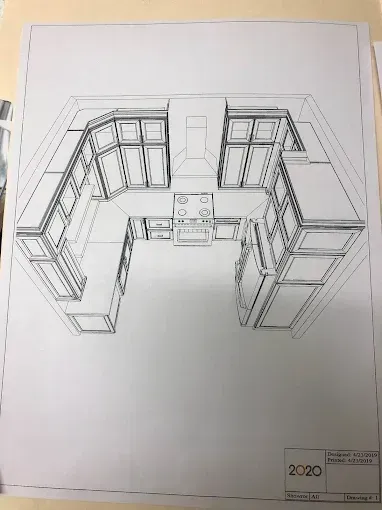 Pencil sketch of a U-shaped kitchen cabinet layout with countertops and window openings on paper