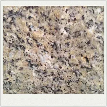 Close-up of beige and gray speckled granite countertop texture