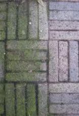 Witte verpakking Promix bestratingreiniger, met blauw etiket en barcode.