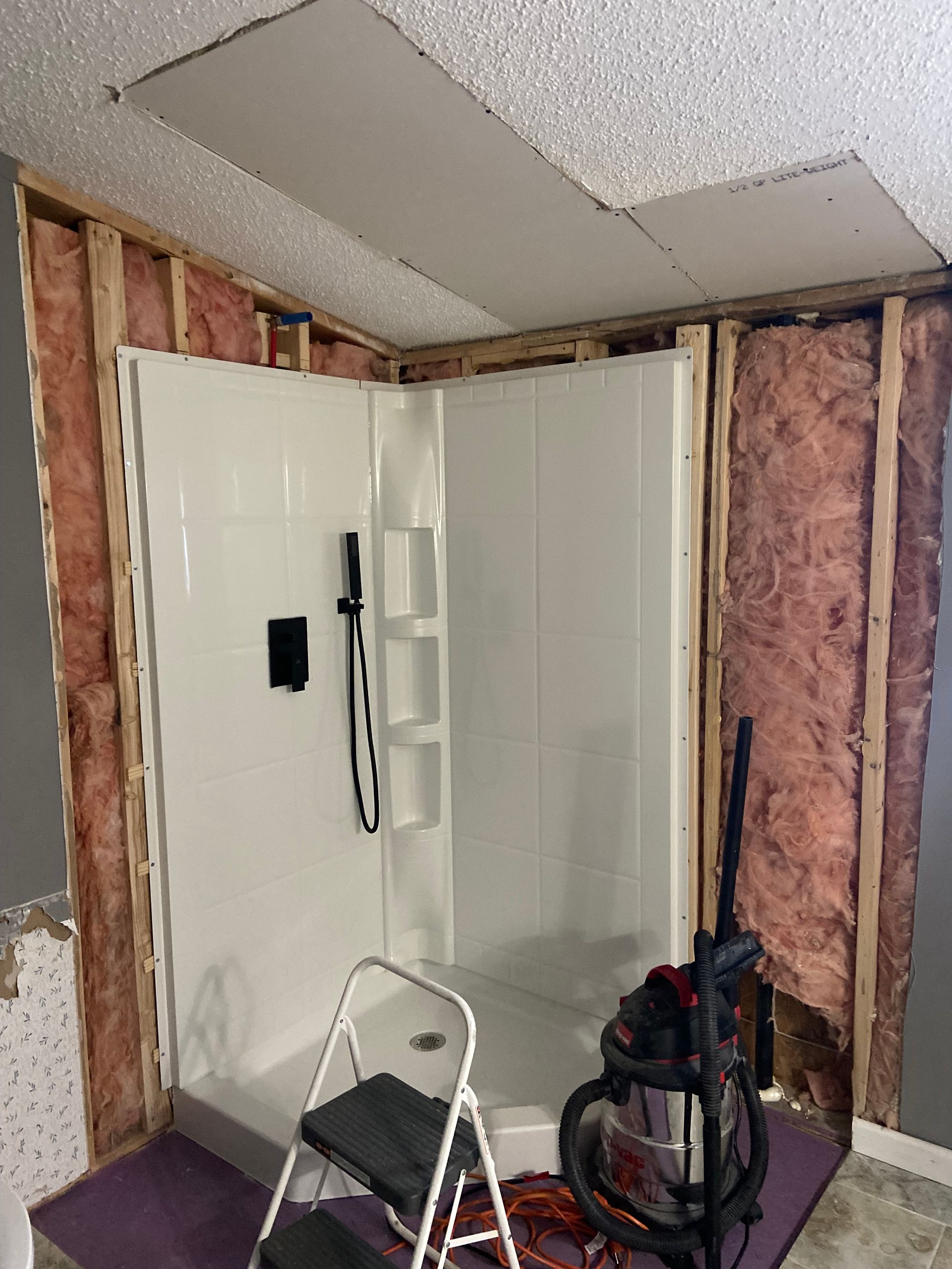 Bathroom dry wall project at the beginning after old sheet rock was removed
