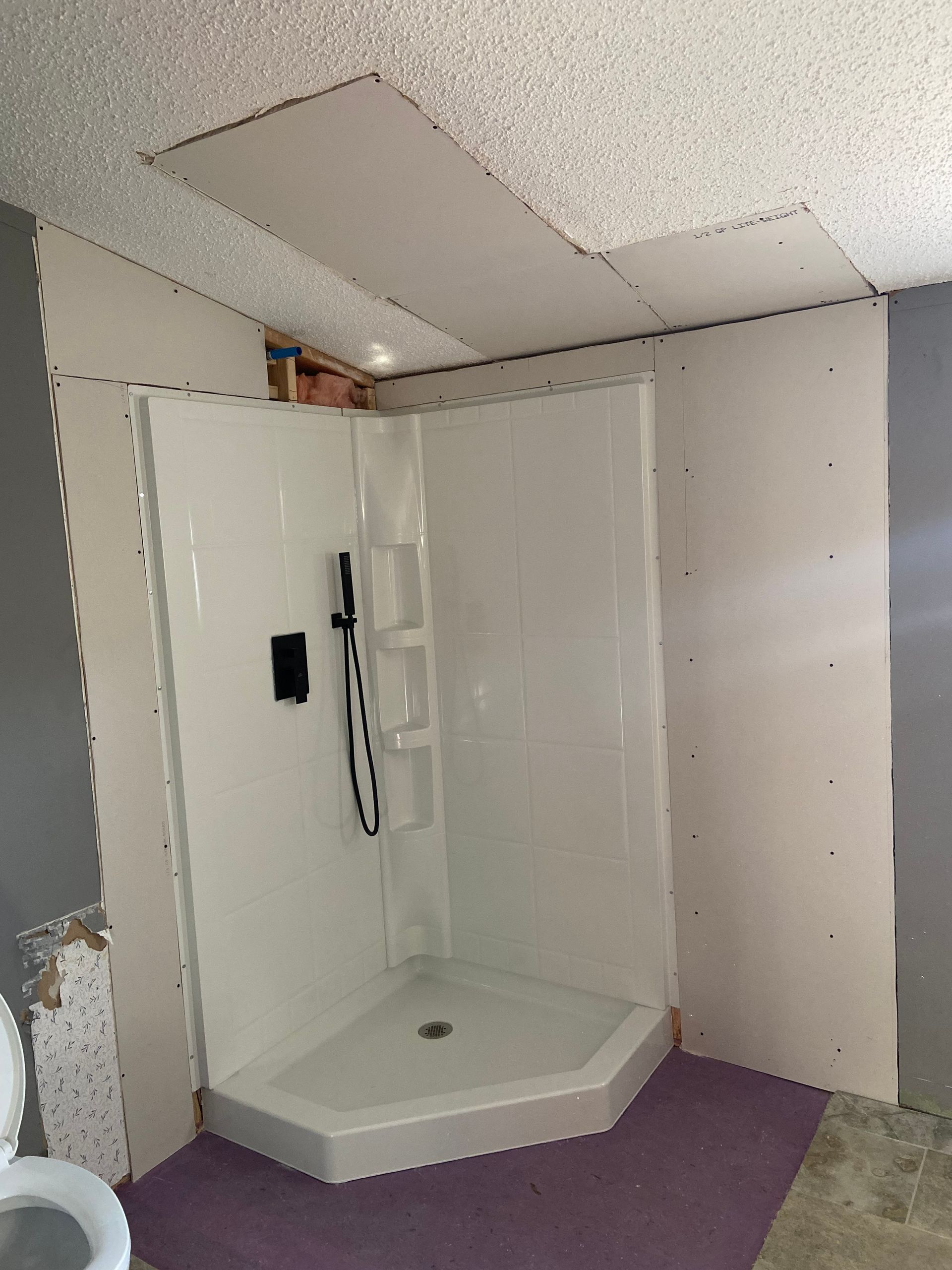 Bathroom drywall after the sheetrock has been hung but not finished