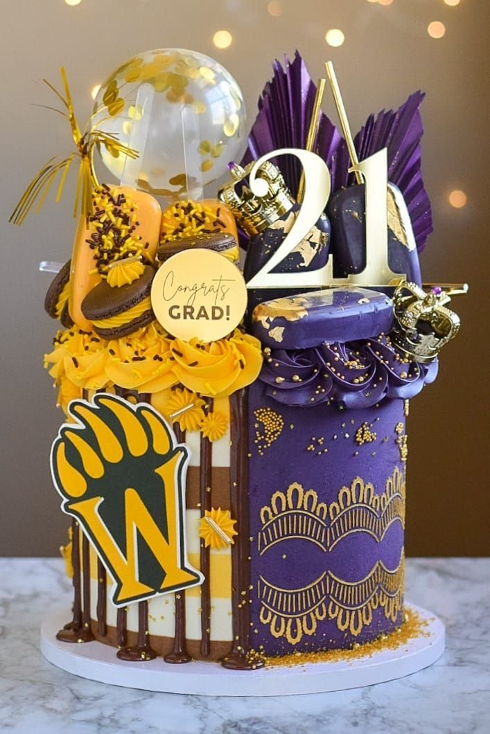 Graduation cake with gold and purple decorations; 