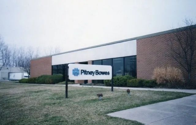 Phiney Browns sign outside a brick industrial building on a cloudy day