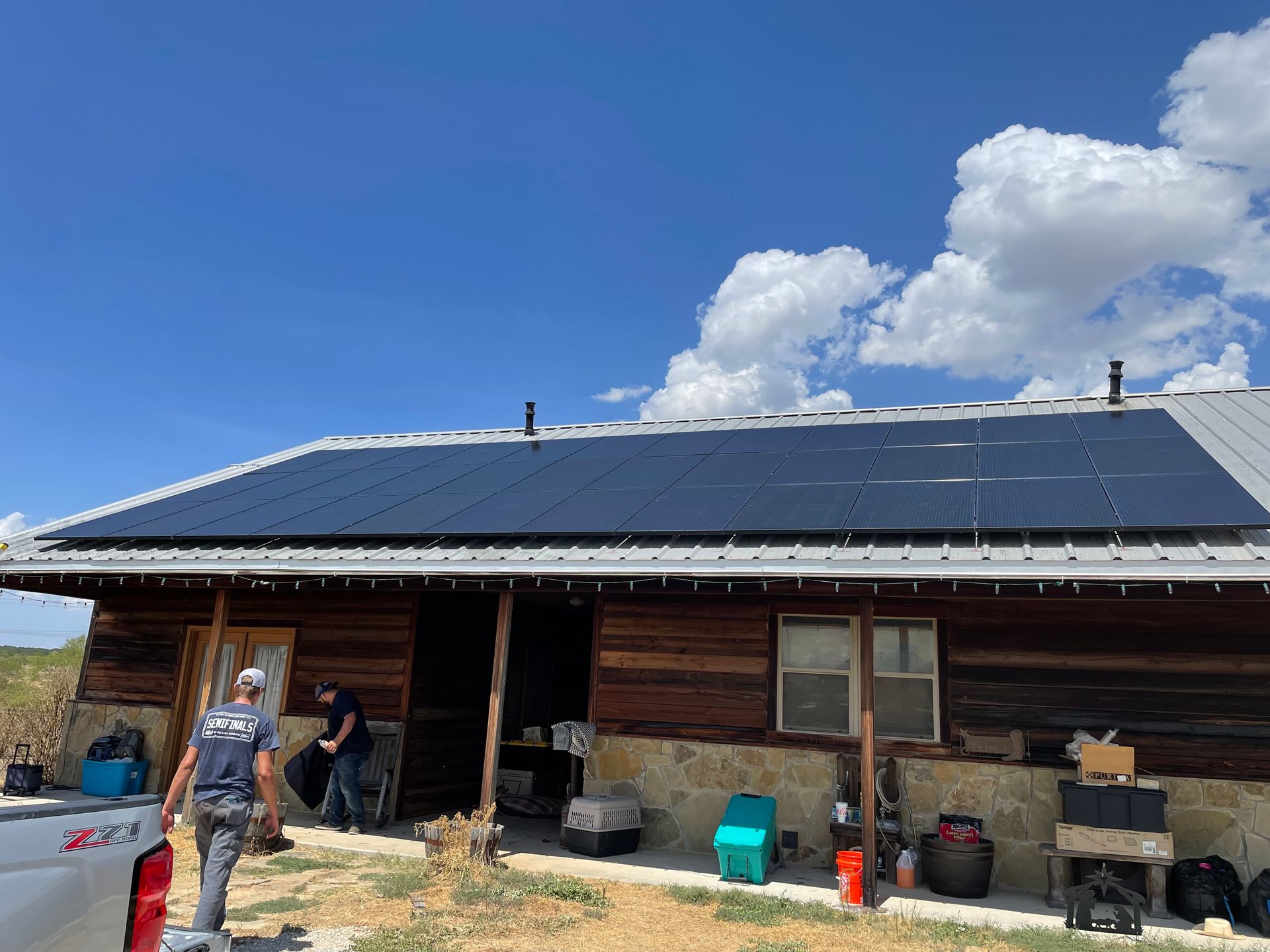 Integrity Solar USA technicians servicing a residential solar panel installation in North Texas
