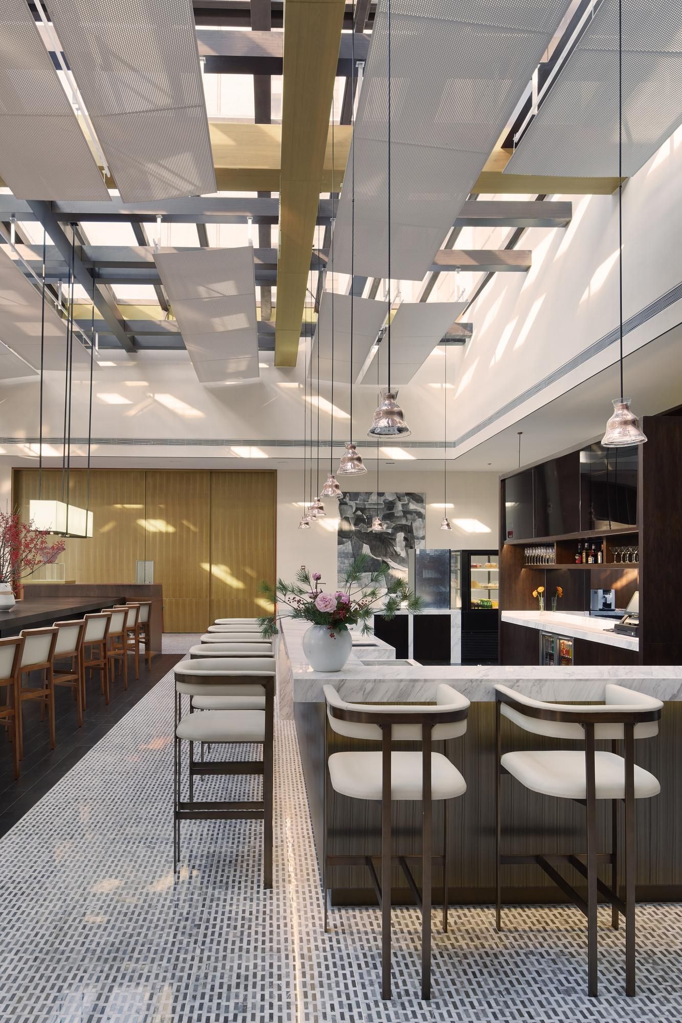 A rendering of a restaurant with a long counter and stools.