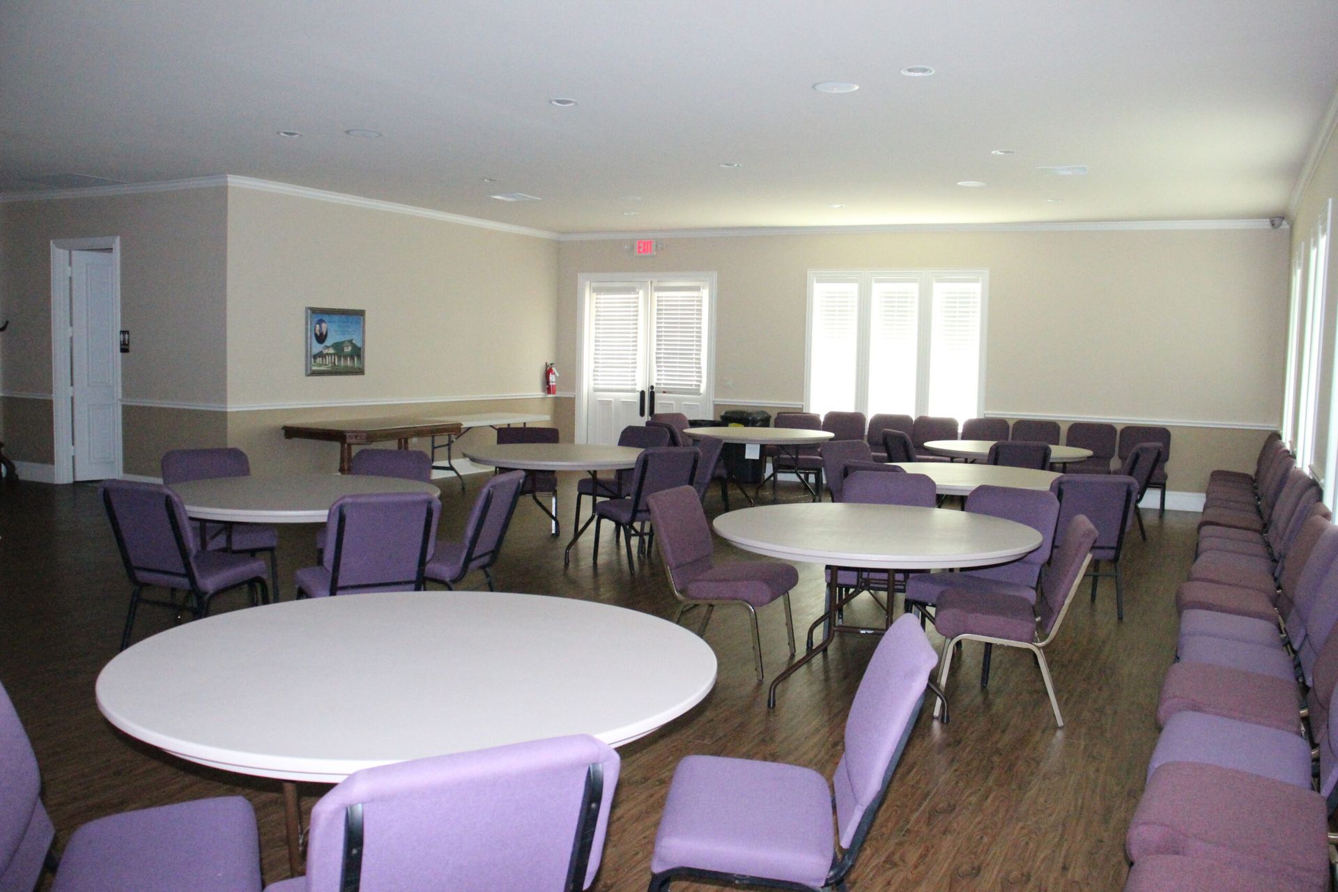 A large room with tables and chairs in it