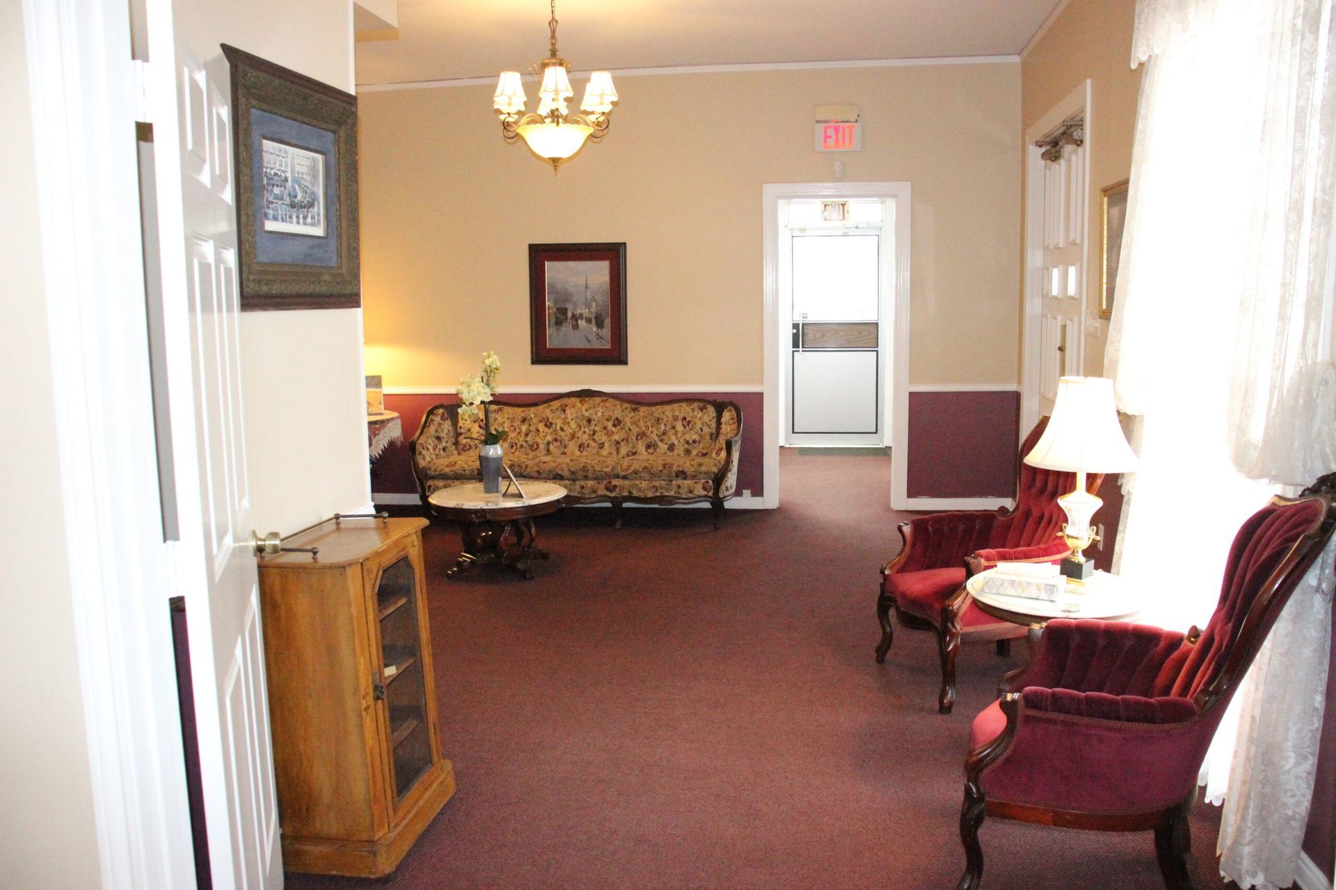 A living room with a couch and chairs in it
