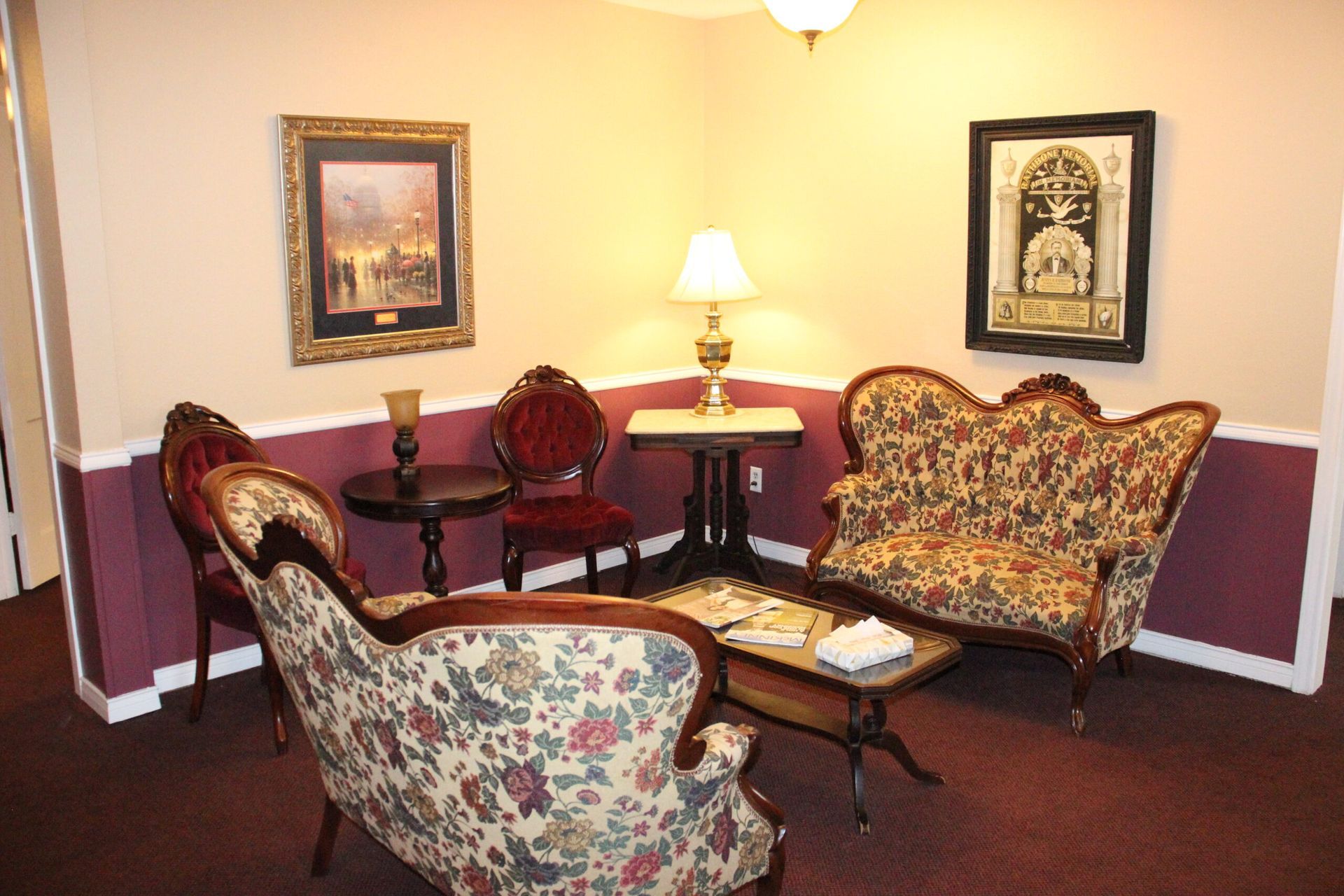 A living room with a couch and chairs and a table