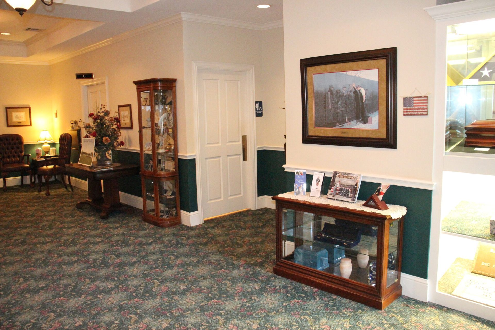 A hallway with a picture of a bear on the wall