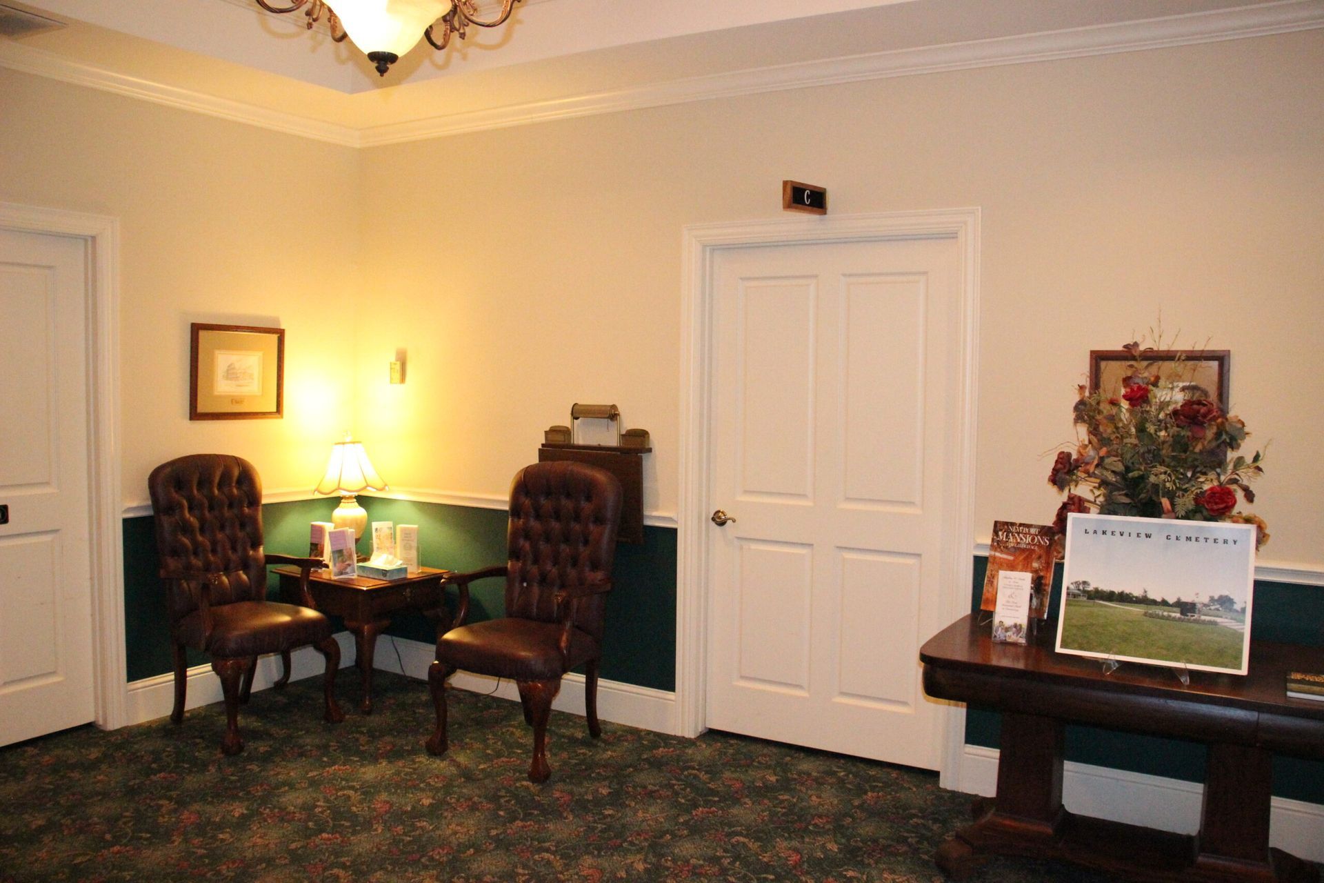 A waiting room with two chairs and a table