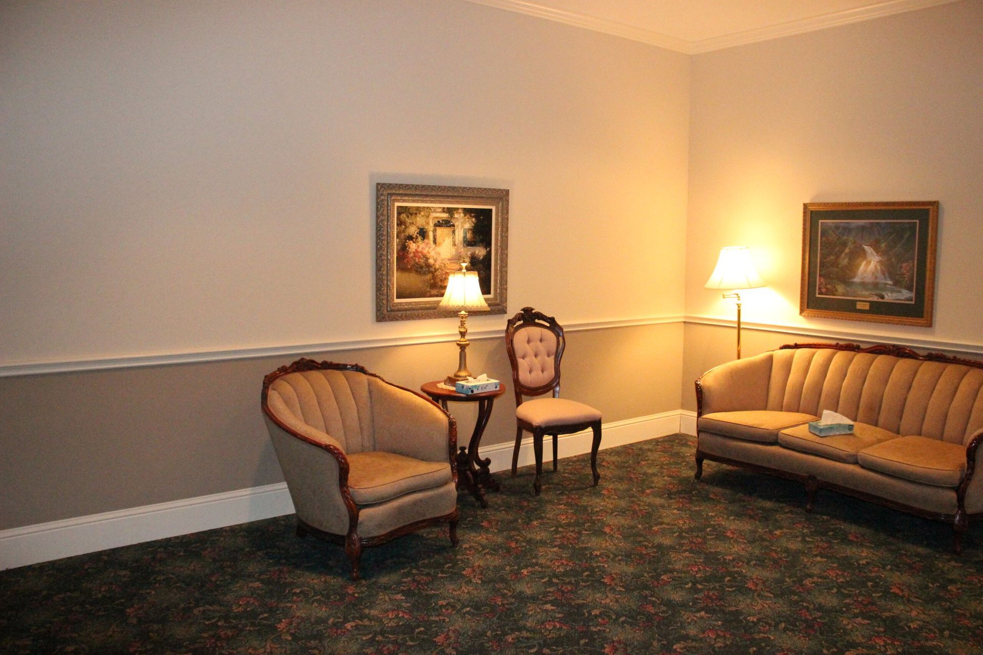 There are two chairs and a couch in the room.