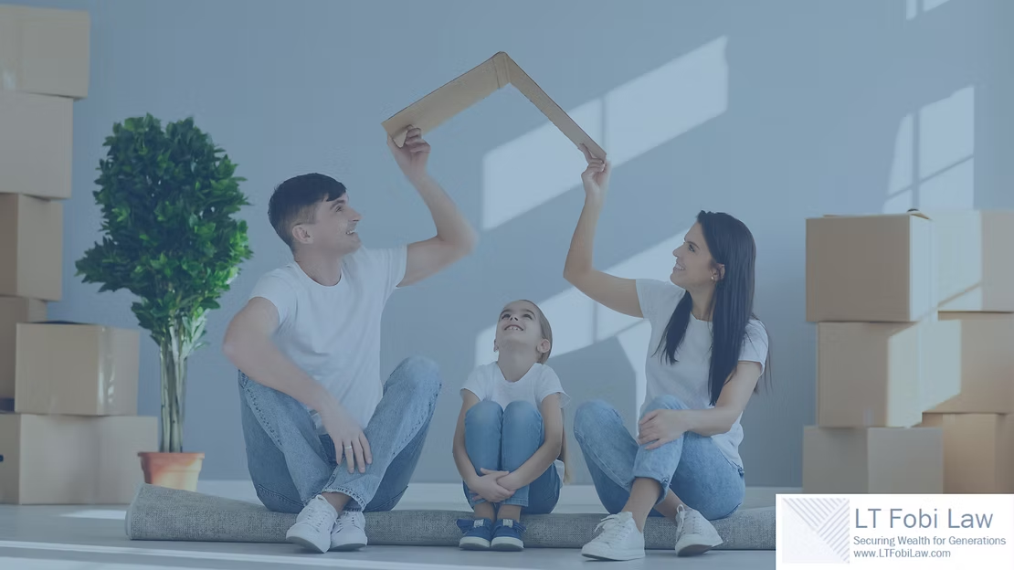 Family unpacking in a bright room, building a cardboard fort beside moving boxes and a potted plant.