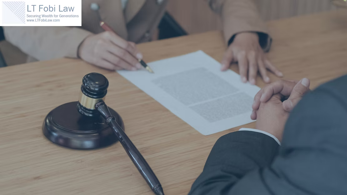Legal consultation with a gavel, document, and two people signing paperwork at a table