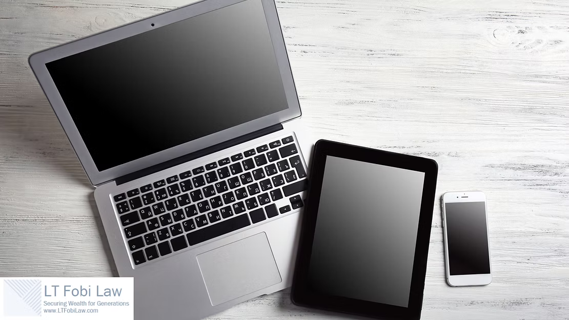 Laptop, tablet, and smartphone on a light wood desk with blank screens.