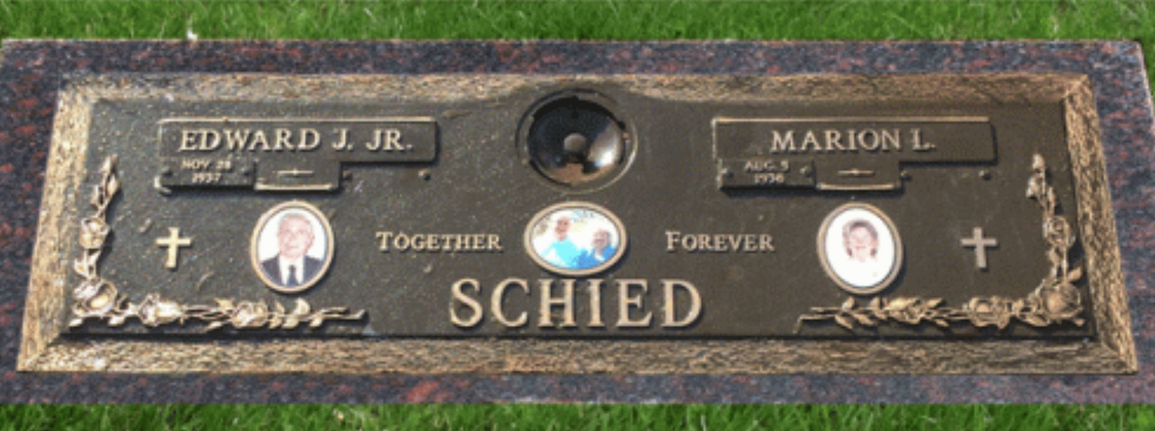Bronze memorial plaque with two portrait medallions and the names Edward L. Jr. and Marcia H. Schied