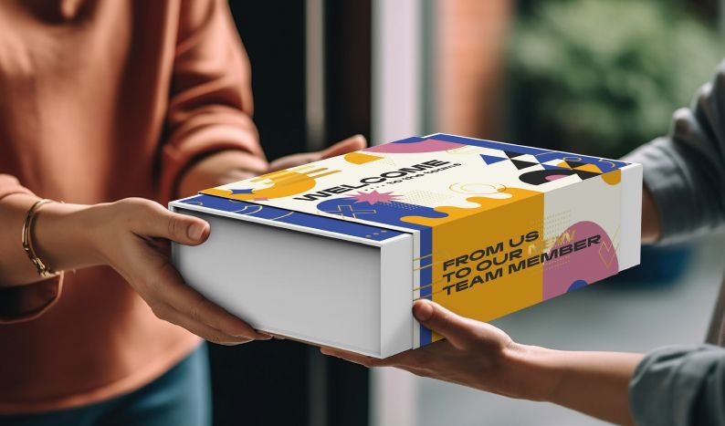 A person is handing a box to another person.