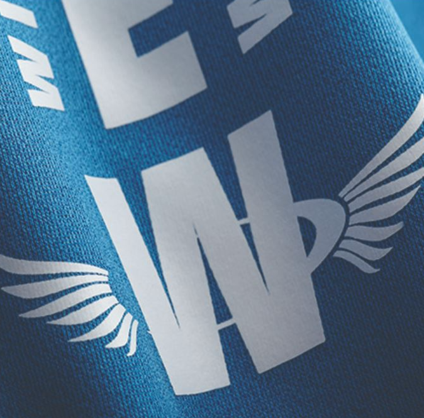 A close up of a blue shirt that says i am w