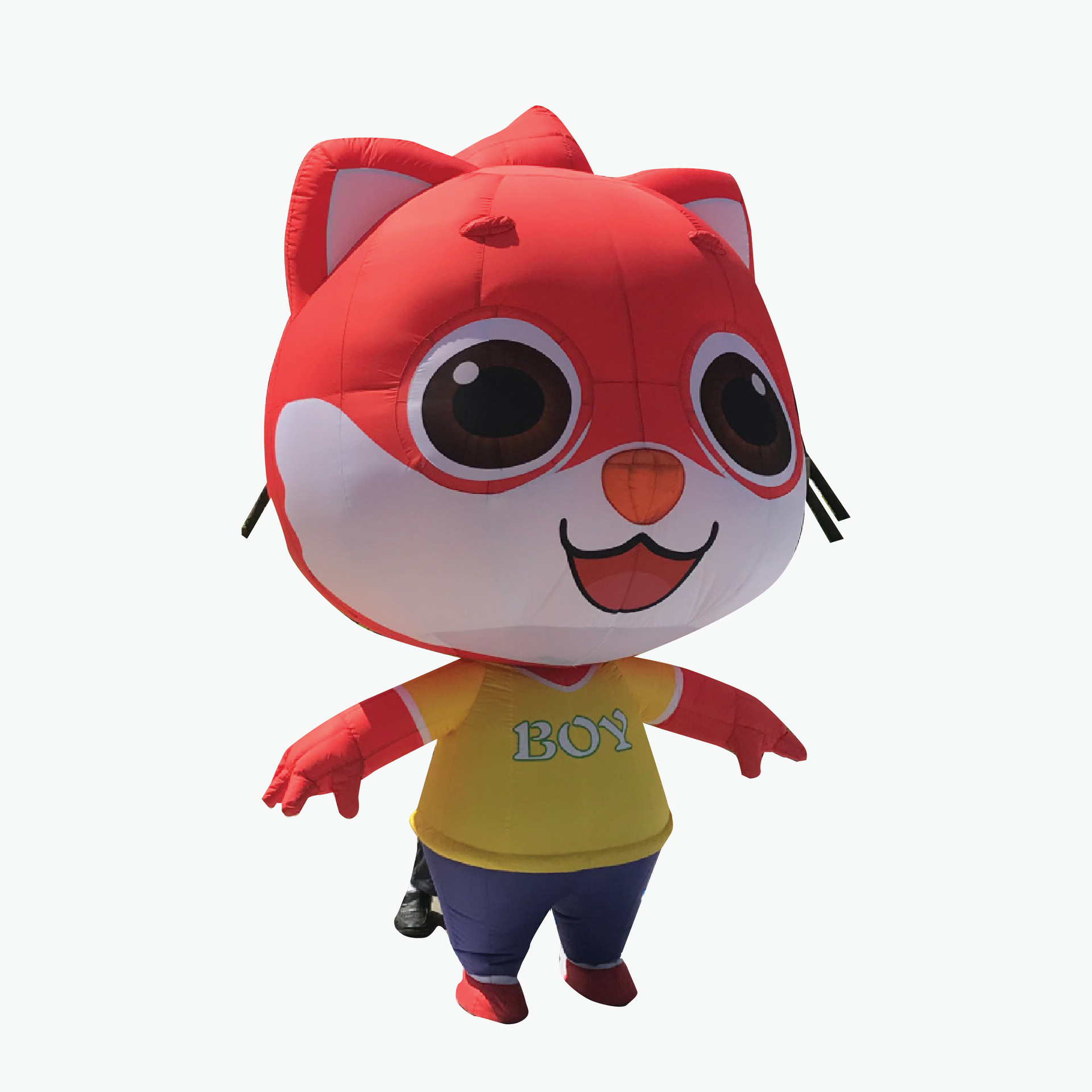 A stuffed animal with a yellow shirt that says boy