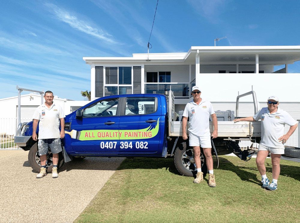 All Quality Painting Team & Vehicle with A House in Background — Painting service in Yeppoon, QLD