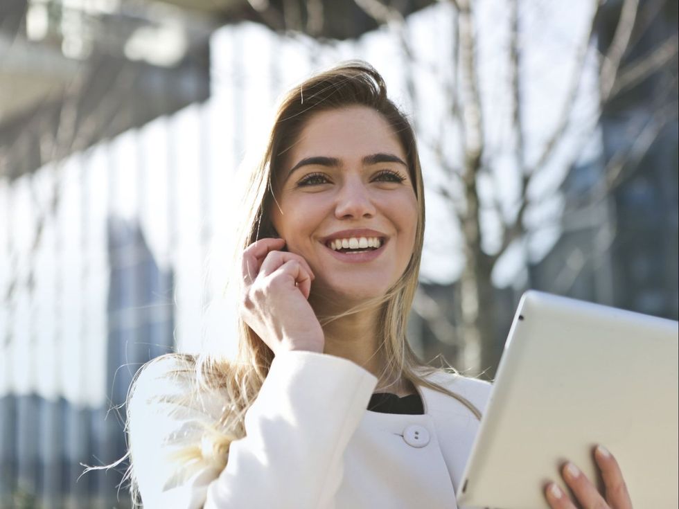 Woman on the phone with ipad