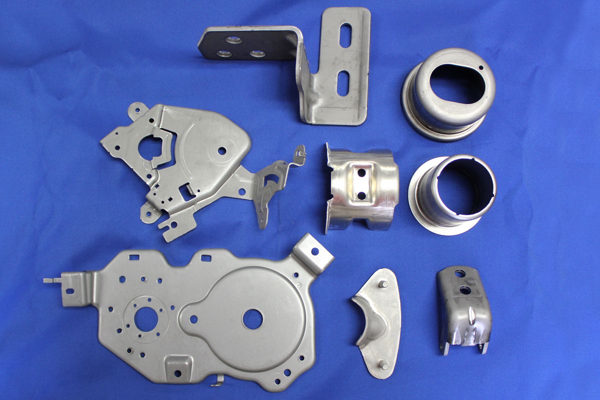 A bunch of metal parts on a blue cloth