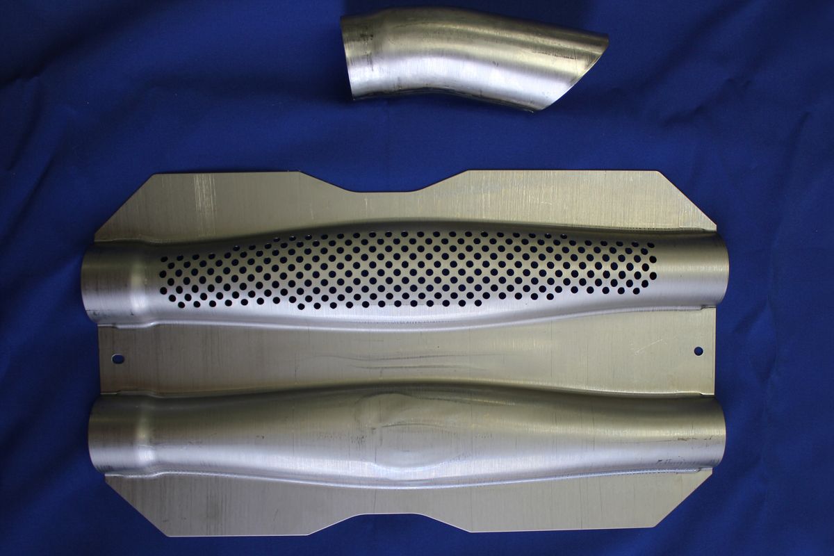 Two metal pipes are sitting on a blue surface