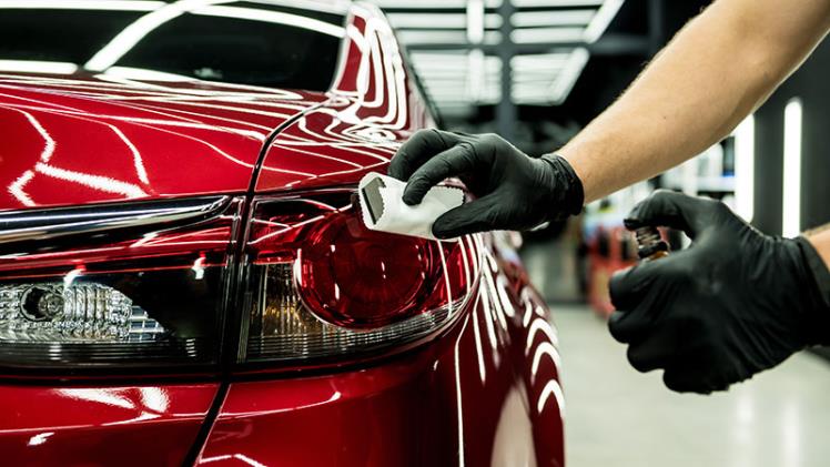 Red car being ceramic coated