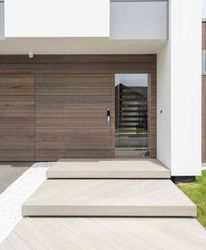 A modern house with a wooden garage door