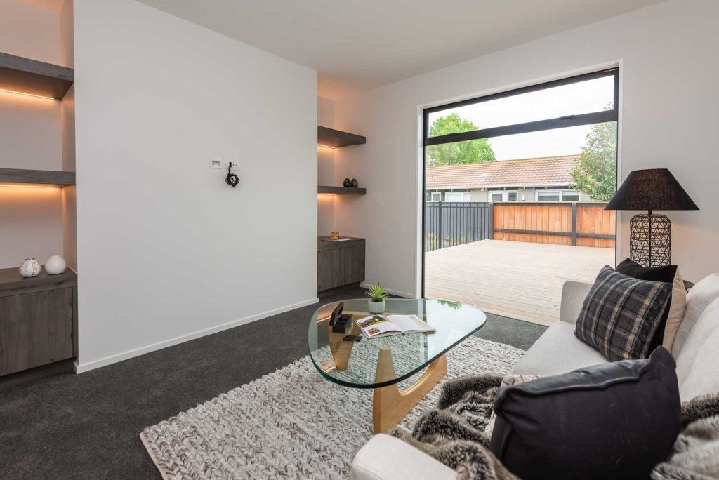 A living room with a couch and a coffee table