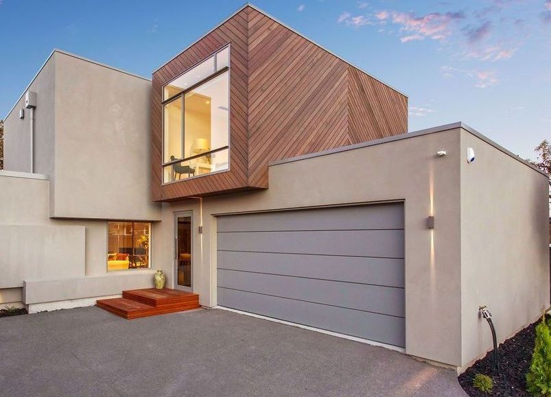 A modern house with a gray garage door