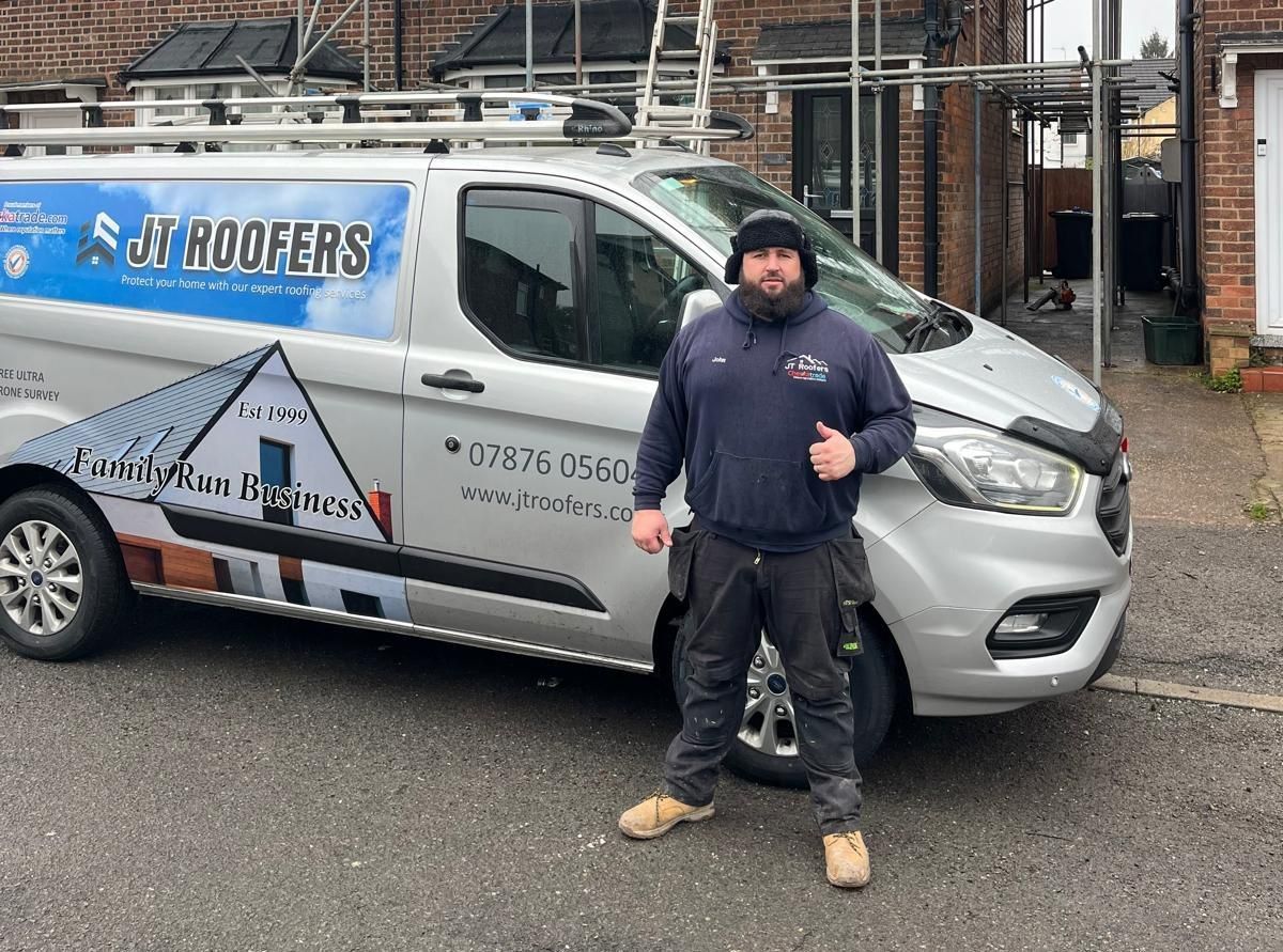 JTB Roofers Nottingham Team stood in front of roofing van